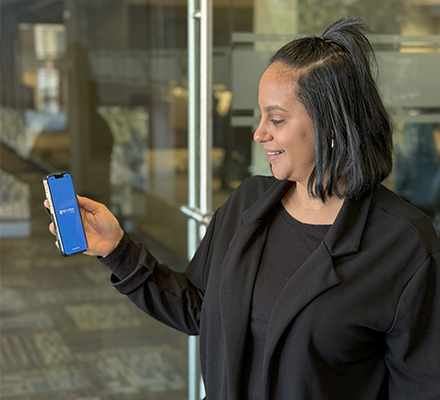 woman holding mobile device